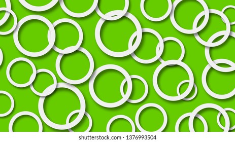 Abstract illustration of randomly arranged white rings with soft shadows on green background