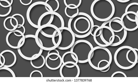 Abstract illustration of randomly arranged white rings with soft shadows on black background