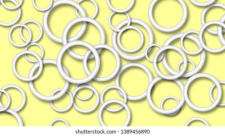 Abstract illustration of randomly arranged white rings with soft shadows on yellow background