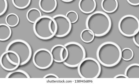 Abstract illustration of randomly arranged white rings with soft shadows on gray background