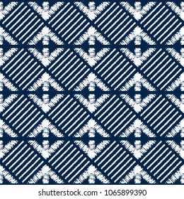 Abstract indigo shibori seamless vector pattern with white print mosaic