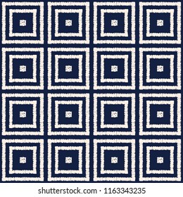 Abstract indigo shibori seamless vector pattern with white ikat print of mosaic