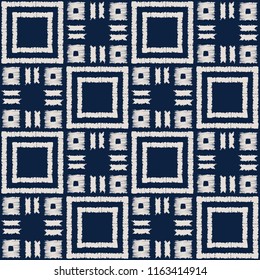 Abstract indigo shibori seamless vector pattern with white ikat print of mosaic