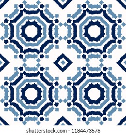 Abstract indigo shibori seamless vector pattern with blue ikat print of mosaic on white background