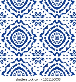 Abstract indigo shibori seamless vector pattern with ikat print of mosaic on white background