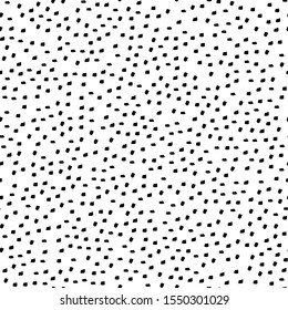 Abstract ink dots seamless background. Minimal trendy hand drawn wallpaper design. Textile and wrapping paper texture.