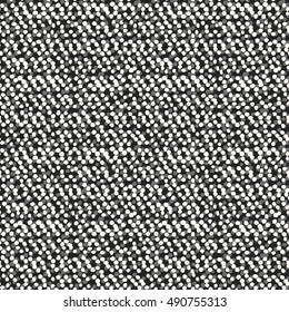 Abstract irregular dots variegated textured background. Seamless pattern.
