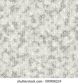 Abstract irregular dotted grunge textured background. Seamless pattern.