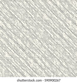 Abstract irregular dotted textured background. Seamless pattern.