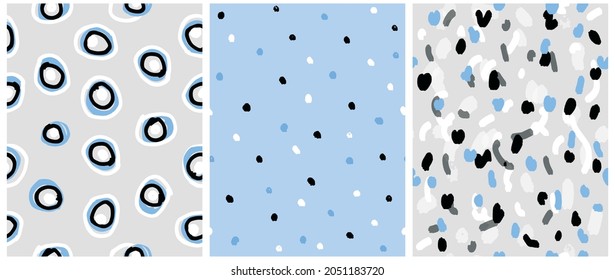 Abstract Irregular Geometric  Seamless Vector Patterns. White, Pink and Black Irregular Brush Spots and Circles on a Pastel Blue and Gray Background. Simple Abstract Doodle Print ideal for Fabric. 
