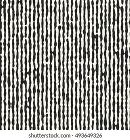 Abstract irregular strokes striped textured background. Seamless pattern.