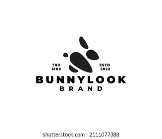 abstract jumping bunny rabbit logo concept vector illustration