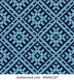 Abstract knitting ornamental seamless vector pattern as a knitted fabric texture in dark and light blue hues