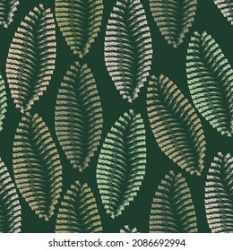 Abstract leaves seamless pattern on green background 