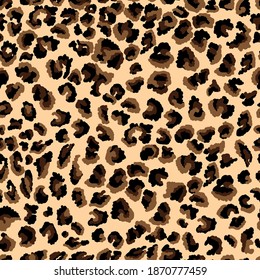 Abstract leopard skin print. Seamless pattern of animal fur cheetah, jaguar. Spots of black and brown on a beige background. Texture - imitation of leopard skin. Vector illustration, speckled pattern