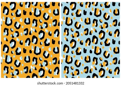 Abstract Leopard Skin Seamless Vector Patterns. Irregular Black, Beige and Yellow Brush Spots on a Yellow and Pastel Blue Background. Abstract Wild Animal Skin Print. Simple Wild Cat Fur Design.