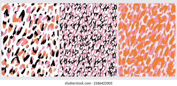 Abstract Leopard Skin Seamless Vector Patterns. White, Pink, Orange and Black Irregular Brush Spots on a White and Pink Backgrounds. Abstract Wild Animal Skin Print. Simple Irregular Geometric Design.