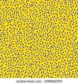 Abstract leopard skin vector seamles pattern. White yellow and black irregular brush spots and gray backgrounds. Abstract wild animal skin print. Simple irregular geometric design.