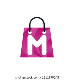 Abstract letter m with shopping bag. Abstract shopping m logo. Online m letter shop logo.m letter shopping logo.Shopping bag