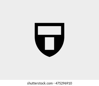 Abstract letter T shield logo design template. 