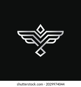 Abstract letter V flying bird minimalist silver design logo. Luxury bird, eagle, hawk, vector line logotype design. Universal premium falcon wing symbol logotype.