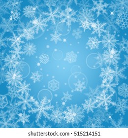 Abstract light blue Christmas background with snowflakes.