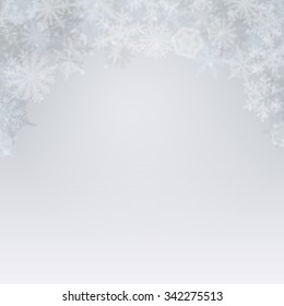 Abstract light winter background with snowflakes.