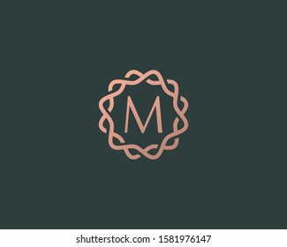 Abstract linear monogram letter M logo icon design modern minimal style illustration. Premium alphabet round wreath frame vector line emblem sign symbol mark logotype
