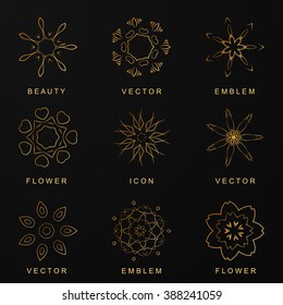 Abstract logos. Set of Gold icons. Gold abstract flowers for your design. Linear style. Creative symbols of beauty and grace. Vector illustration.