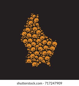 abstract map of luxembourg filled with orange halloween pumpkins heads on a black background
