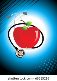 abstract medical background with stethoscope and fresh red apple