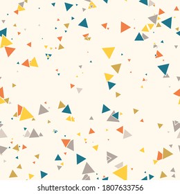 Abstract Memphis seamless pattern with colorful chaotic small triangles. Infinity triangular messy geometric pattern. Colorful Terrazzo tile. Vector illustration.
