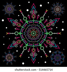 Abstract minimal set of five vector green and pink snowflakes on a black background.