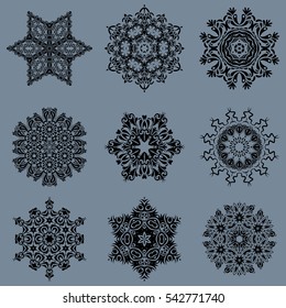 Abstract minimal set of nine vector snowflakes on a neutral background.
