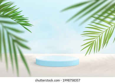 Abstract minimalistic background in blue tones. Cylindrical pedestal for product demonstration against a background of tropical leaves.