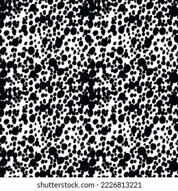 Abstract modern dalmatian fur seamless pattern. Animals trendy background. Black and white decorative vector illustration for print, card, postcard, fabric, textile. Modern ornament of stylized skin.