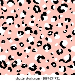 Abstract modern leopard seamless pattern. Animals trendy background. Beige and black decorative vector stock illustration for print, card, postcard, fabric, textile. Modern ornament of stylized skin.