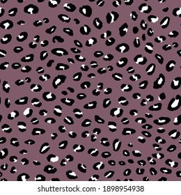Abstract modern leopard seamless pattern. Animals trendy background. Pink and black decorative vector stock illustration for print, card, postcard, fabric, textile. Modern ornament of stylized skin.