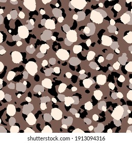 Abstract modern leopard seamless pattern. Animals trendy background. Beige and black decorative vector stock illustration for print, card, postcard, fabric, textile. Modern ornament of stylized skin.