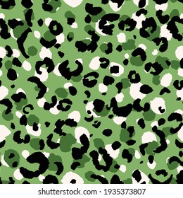 Abstract modern leopard seamless pattern. Animals trendy background. Green and black decorative vector stock illustration for print, card, postcard, fabric, textile. Modern ornament of stylized skin.