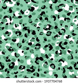 Abstract modern leopard seamless pattern. Animals trendy background. Green and black decorative vector stock illustration for print, card, postcard, fabric, textile. Modern ornament of stylized skin