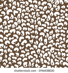 Abstract modern leopard seamless pattern. Animals trendy background. Beige and white decorative vector stock illustration for print, card, postcard, fabric, textile. Modern ornament of stylized skin.