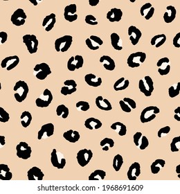 Abstract modern leopard seamless pattern. Animals trendy background. Beige and white decorative vector illustration for print, card, postcard, fabric, textile. Modern ornament of stylized skin.