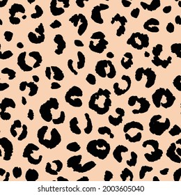 Abstract modern leopard seamless pattern. Animals trendy background. Beige and black decorative vector stock illustration for print, card, postcard, fabric, textile. Modern ornament of stylized skin.