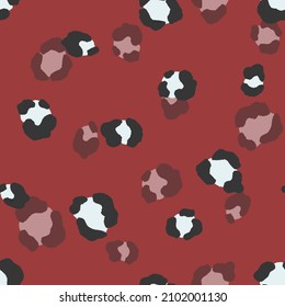 Abstract modern leopard seamless pattern. Animals trendy background. Red and black decorative vector stock illustration for print, card, postcard, fabric, textile. Modern ornament of stylized skin.
