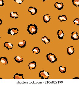 Abstract modern leopard seamless pattern. Animals trendy background. Orange and black decorative vector stock illustration for print, card, postcard, fabric, textile. Modern ornament of stylized skin.