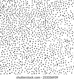 Abstract monochrome dotted background. Freehand grunge vector pattern.