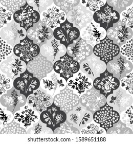 Abstract moroccan geometric seamless pattern with flower, twigs, leaves silhouettes. Unusual floral background in patchwork style, black and white colors. Hand drawn geometry vector illustration
