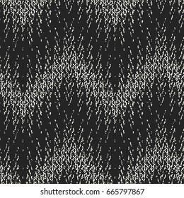 Abstract mottled textured zigzag motif. Seamless pattern.
