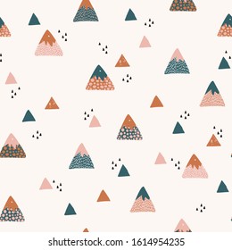 Abstract mountains seamless pattern. Cute geometric and doodle mountain background. Vector illustration in nordic style for textile, wallpaper, surface design